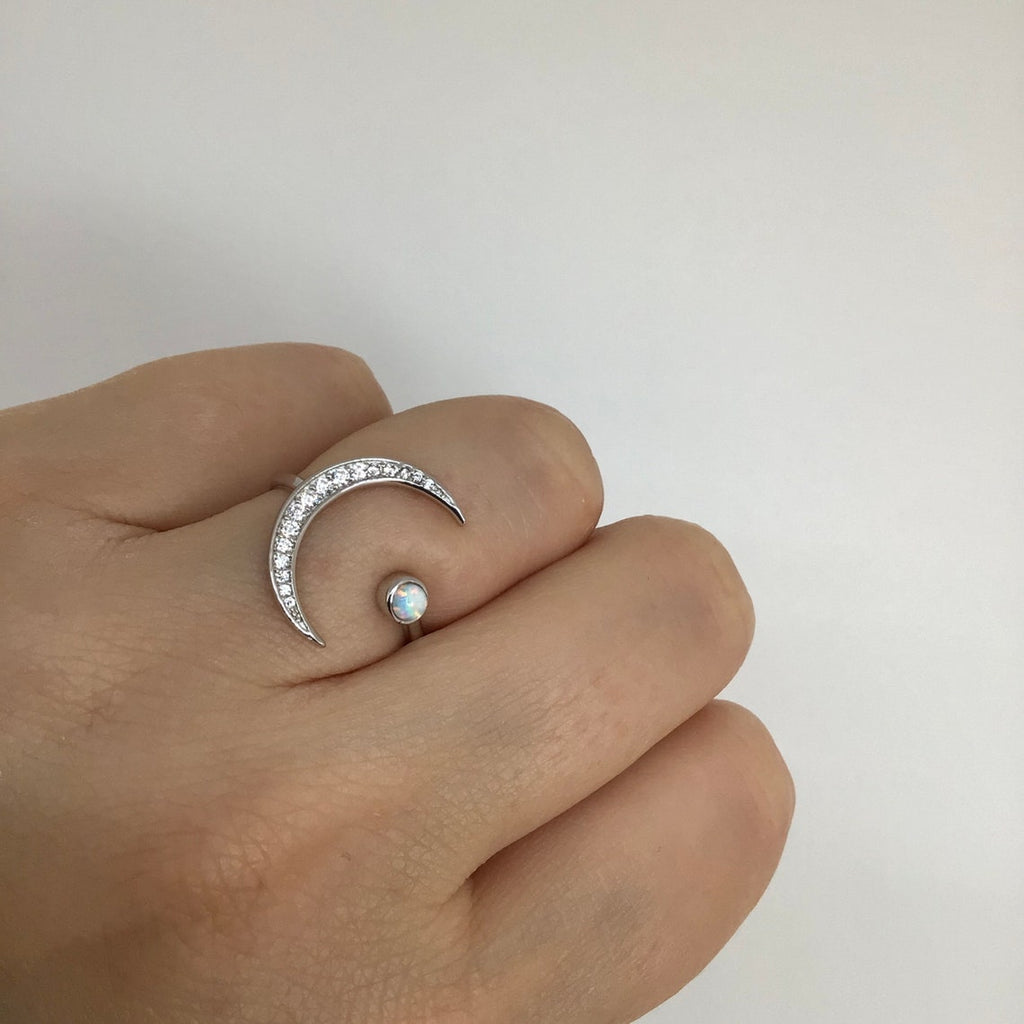 Crescent moon with white opal ring