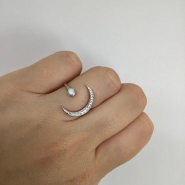 Crescent moon with white opal ring